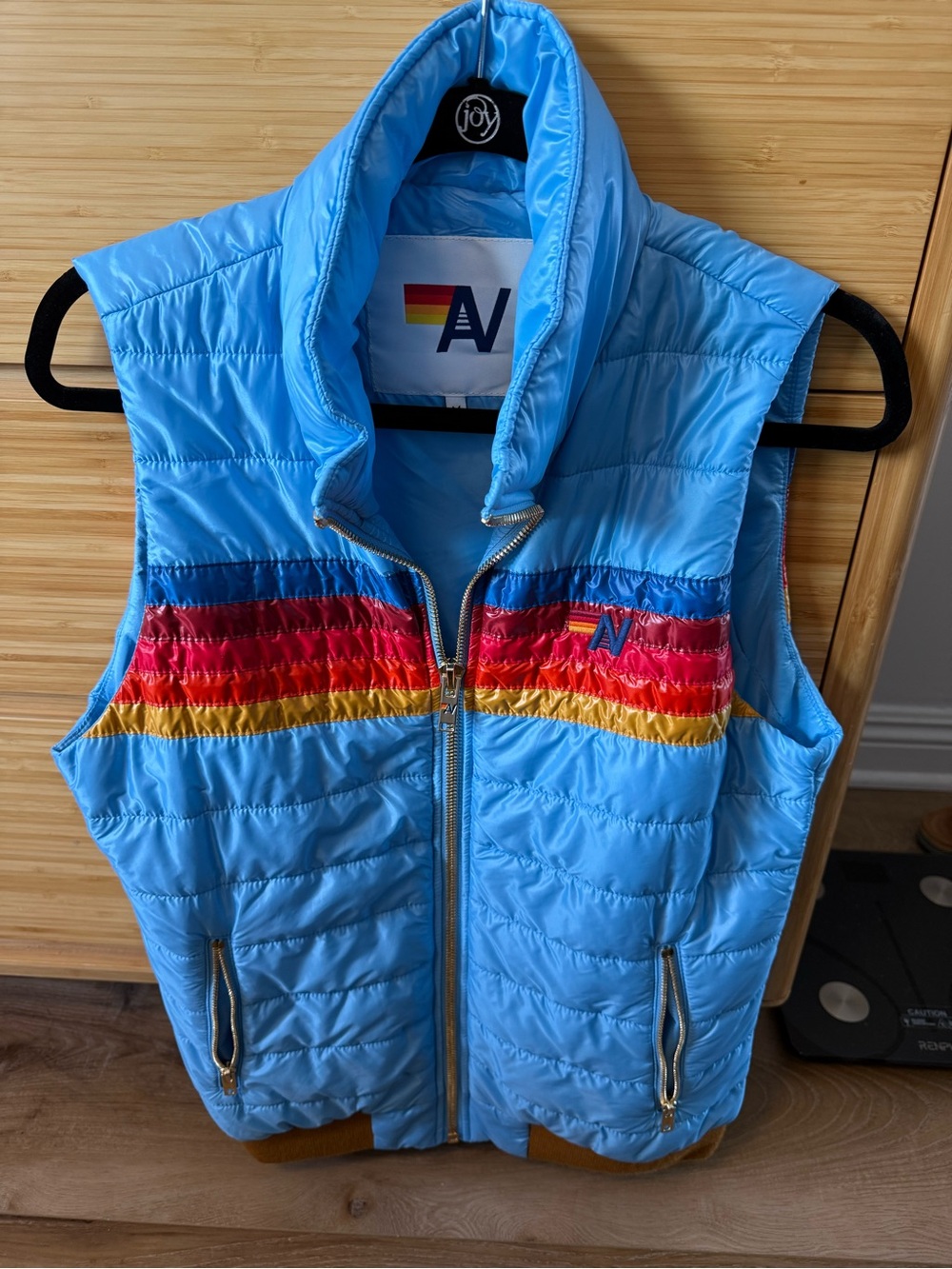 Aviator Nation Light Blue Puffer Vest with Rainbow Stripe